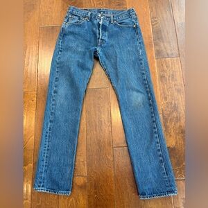 Levi 501 29x30 denim pant. Small stain on knee